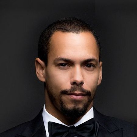 Bryton in his black suit